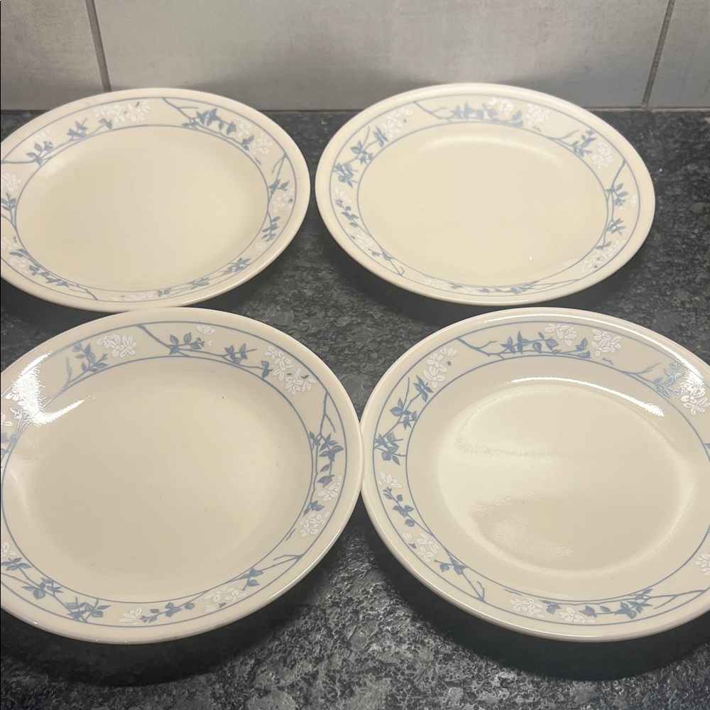 Set of 4 Salad plates by Corelle. FIRST OF SPRING. Exc condition